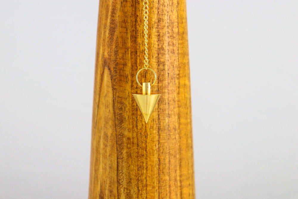 pendule cone en laiton plaqué or